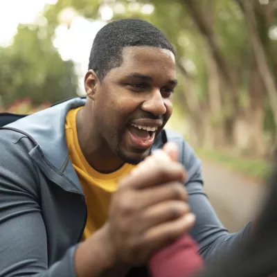 Man laughing outdoors
