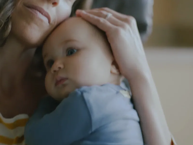 A mother holding her baby