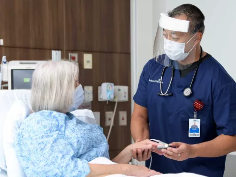 A nurse doing a medical test on a patient