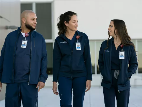 3 AdventHealth Team Members walking together 