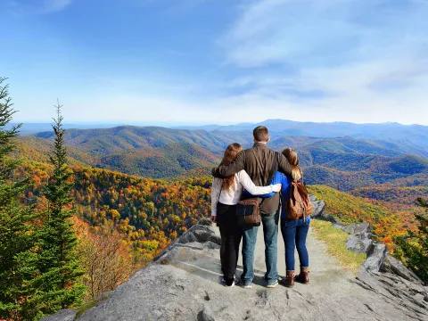 A family seeing a vast view of the mountains