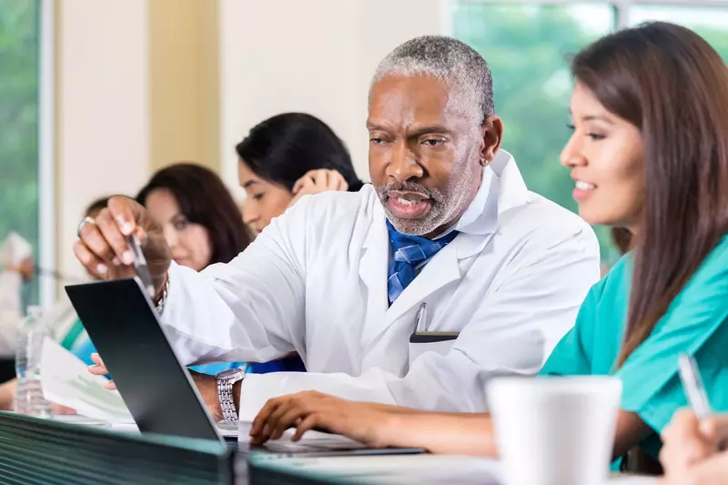 Physicians learning in a classroom.