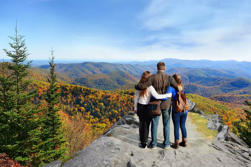 A family seeing a vast view of the mountains